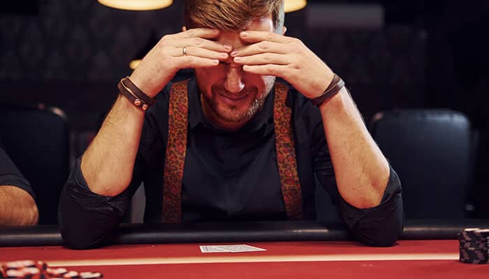 Man frustrated with his poker hand
