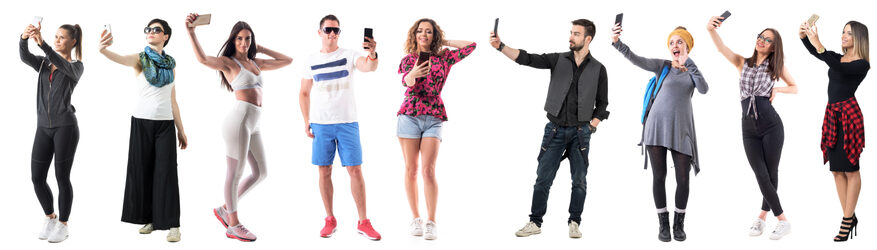 a diverse crowd capturing memories with selfies
