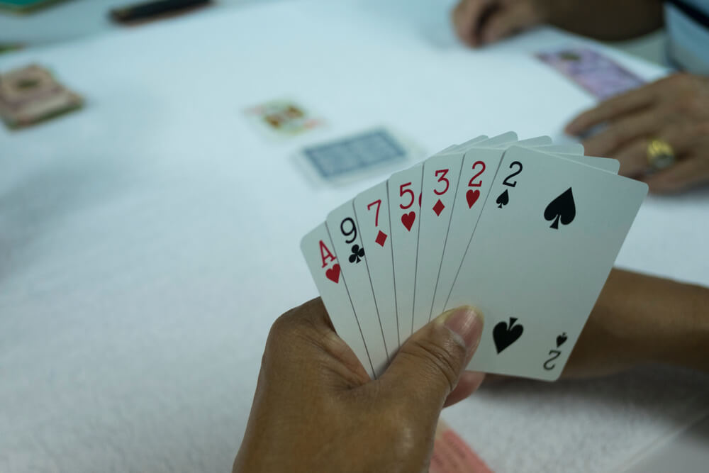 A deck of cards in a poker hand