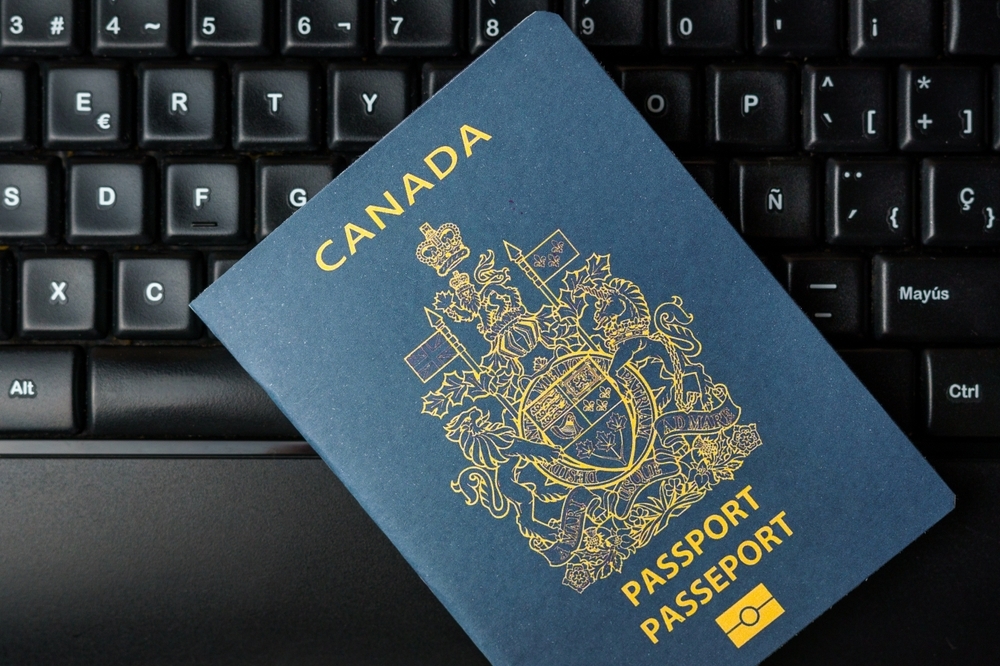 Image a Canadian passport on a keyboard